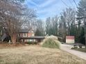 Brick home with landscaping and detached shed at 110 30Th Nw Ave, Hickory, NC 28601