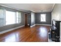 Spacious living room with hardwood floors and a fireplace at 1138 Norland Rd, Charlotte, NC 28205