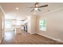 Open concept kitchen with island, stainless steel appliances, and hardwood floors at 116 Durham Rd, Stanley, NC 28164