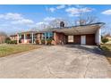 Brick ranch house with carport and spacious yard at 133 Fieldstone Farm Dr, Statesville, NC 28625