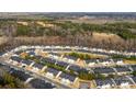 An aerial view of a residential neighborhood with well-maintained homes and lush greenery at 1355 Amberlight Cir, Salisbury, NC 28144