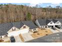 Aerial view of the home showcasing its location, landscaping, and proximity to nearby homes at 1355 Amberlight Cir, Salisbury, NC 28144