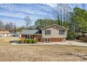 Charming split-level home with brick and siding exterior, neat landscaping, and classic curb appeal at 1401 Southwest Blvd, Newton, NC 28658