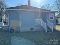 Rear view of house with steps and yard at 1440 Rhodes Rhyne Rd, Lincolnton, NC 28092