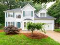 Traditional two-story home featuring a well-maintained lawn and an attached two-car garage at 172 Foxtail Dr, Mooresville, NC 28117
