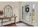 Inviting foyer with beautiful hardwood flooring and a decorative entryway at 200 Staffordshire Dr, Statesville, NC 28625