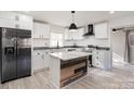 Modern kitchen features white cabinetry, stainless steel appliances, and a central island at 2624 Ashley Rd, Charlotte, NC 28208