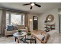 Cozy living room with a large window, neutral decor, and stylish furniture at 2624 Ashley Rd, Charlotte, NC 28208