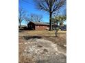 Brick ranch home with a gravel driveway at 29086 Sweet Home Church Rd, Albemarle, NC 28001