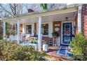 Inviting front porch with rocking chairs and decor at 303 Edgewood Rd, Shelby, NC 28150