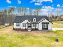 Beautiful home with a well-maintained lawn and a charming exterior design, set against a serene backdrop at 4011 Brandy Creek Ct, Clover, SC 29710