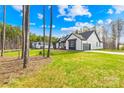 Beautiful single-Gathering home with a two car garage, green grass lawn and mature trees at 4011 Brandy Creek Ct, Clover, SC 29710