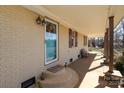 Covered porch with teal door and stone steps at 416 Delview Dr, Cherryville, NC 28021