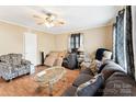 Cozy living room featuring hardwood floors, a ceiling fan, and comfortable seating with lots of natural light at 453 Bynum Ave, Rock Hill, SC 29732