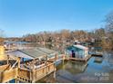 Scenic lakefront view with gazebo and floating dock at 513 Paradise Cir, Belmont, NC 28012