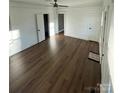 Bright living room featuring hardwood floors and multiple entries at 516 Washington St, Cramerton, NC 28032