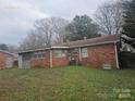 Back of the house showing a patio and yard at 6209 Channing Ct, Charlotte, NC 28215