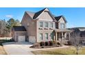 Charming brick home with a three car garage and manicured front yard at 6361 Willow Farm Dr, Denver, NC 28037