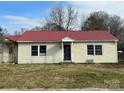 Front view of a yellow sided ranch home with red metal roof at 649 Arch Dr, Rock Hill, SC 29730