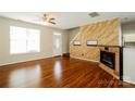 Living room with hardwood floors, fireplace, and kitchen views at 733 Jones Branch Rd, Fort Mill, SC 29715