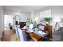 Dining room with a view of an adjacent sitting area at 10630 Tuff Ln, Davidson, NC 28036