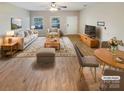 Virtually staged living room with light beige furniture and hardwood floors at 118 Cadbury Ln, Fort Mill, SC 29715