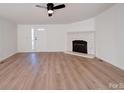 Living room featuring a fireplace and laminate floors at 204 Regency Rd, Mooresville, NC 28117