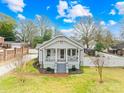 Inviting home with a classic front porch, landscaped yard, and charming curb appeal at 27 Dove Sw Ave, Concord, NC 28025