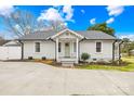 Well-maintained home with a tidy front yard, light-colored paint, and neat landscaping at 27 Dove Sw Ave, Concord, NC 28025