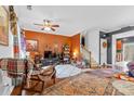 Eclectic living room showcasing an open layout, unique decor, and hardwood floors at 3028 Summerfield Ridge Ln, Matthews, NC 28105