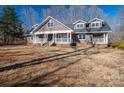 Two-story home with wraparound porch and large yard at 3044 Old Church Rd, Gastonia, NC 28052