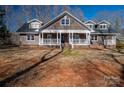 Two-story home with wraparound porch and large yard at 3044 Old Church Rd, Gastonia, NC 28052