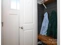 Small coat closet with wooden bench and shelving at 5063 Gribble Ln, Lancaster, SC 29720