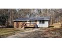 Brick ranch house with wooden deck, and a fenced yard at 704 W Border St, Dallas, NC 28034