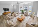 Virtually staged living room featuring neutral furniture and hardwood floors at 7310 Sun Dance Dr, Fort Mill, SC 29707