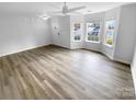 Bright living room with hardwood floors and bay window at 7310 Sun Dance Dr, Fort Mill, SC 29707