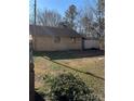 Large backyard with shed and block wall at 784 Crestmont Se Dr, Concord, NC 28025