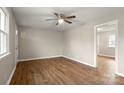 Airy living room with new luxury vinyl plank flooring and a neutral color palette at 901 Wyke Rd, Shelby, NC 28150