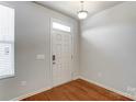 Bright entryway with hardwood floors and white door at 104 N Canyon Ridge Dr, Mount Holly, NC 28120