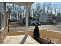 A view of a community street with well-maintained lawns and various home styles visible at 104 Sycamore Crossing Ct, Locust, NC 28097