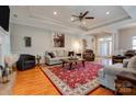 Bright living room boasts hardwood floors, a trey ceiling, and ample seating at 105 Plantation Ct, Shelby, NC 28150