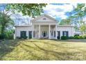 White brick home with a grand portico and columned entryway at 1139 Hermitage Rd, Rock Hill, SC 29732