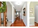 Welcoming foyer featuring hardwood floors, neutral walls, and an open view to the living room at 162 Misty Woods Dr, Lake Wylie, SC 29710