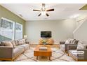 Virtually staged living room featuring gray sofas and a wooden coffee table at 1721 Ameria Rd, Charlotte, NC 28215