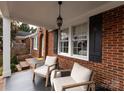 Relaxing covered porch with wicker chairs and a hanging lantern at 2121 Winter St, Charlotte, NC 28205