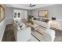 Spacious living room featuring hardwood floors and a neutral color palette at 2139 Mallard Green Pl, Charlotte, NC 28262