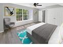 Main bedroom with a large window, hardwood floors, and ample closet space at 2139 Mallard Green Pl, Charlotte, NC 28262