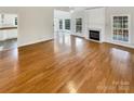 Hardwood floors throughout the living room, with a view into the kitchen at 3013 Tiffany Dr, Monroe, NC 28110