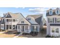 Two-story craftsman style home with gray siding and white accents at 3089 Virginia Trail Ct, Fort Mill, SC 29715