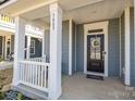 Front porch with white columns and gray railings at 3089 Virginia Trail Ct, Fort Mill, SC 29715